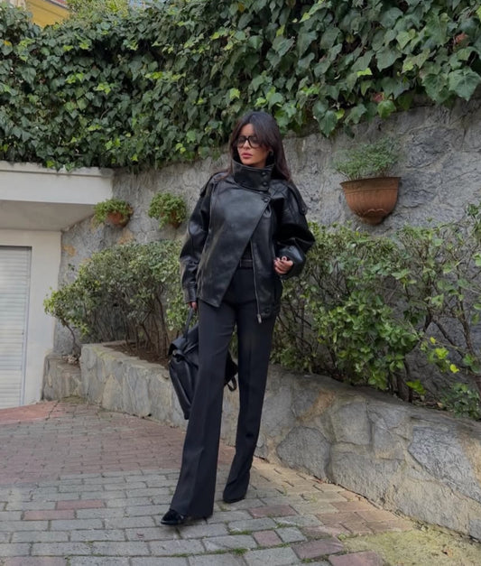 This piece reimagines the classic moto style with an oversized, contemporary edge. Crafted from sleek faux leather, this jacket is a true statement piece designed to elevate any outfit.