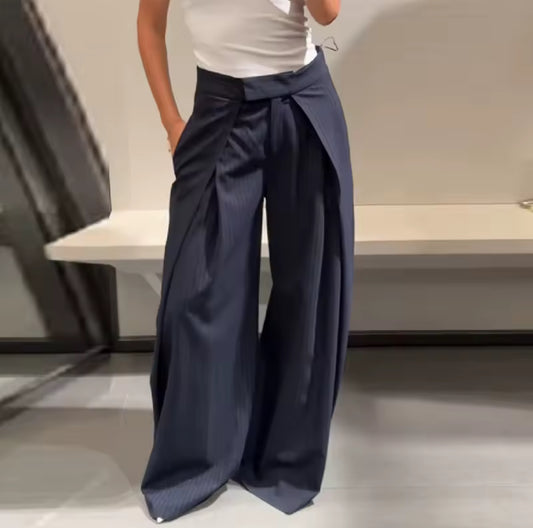 These wide-leg, pleated trousers bring immediate drama and structure to any look. Navy Blue Color