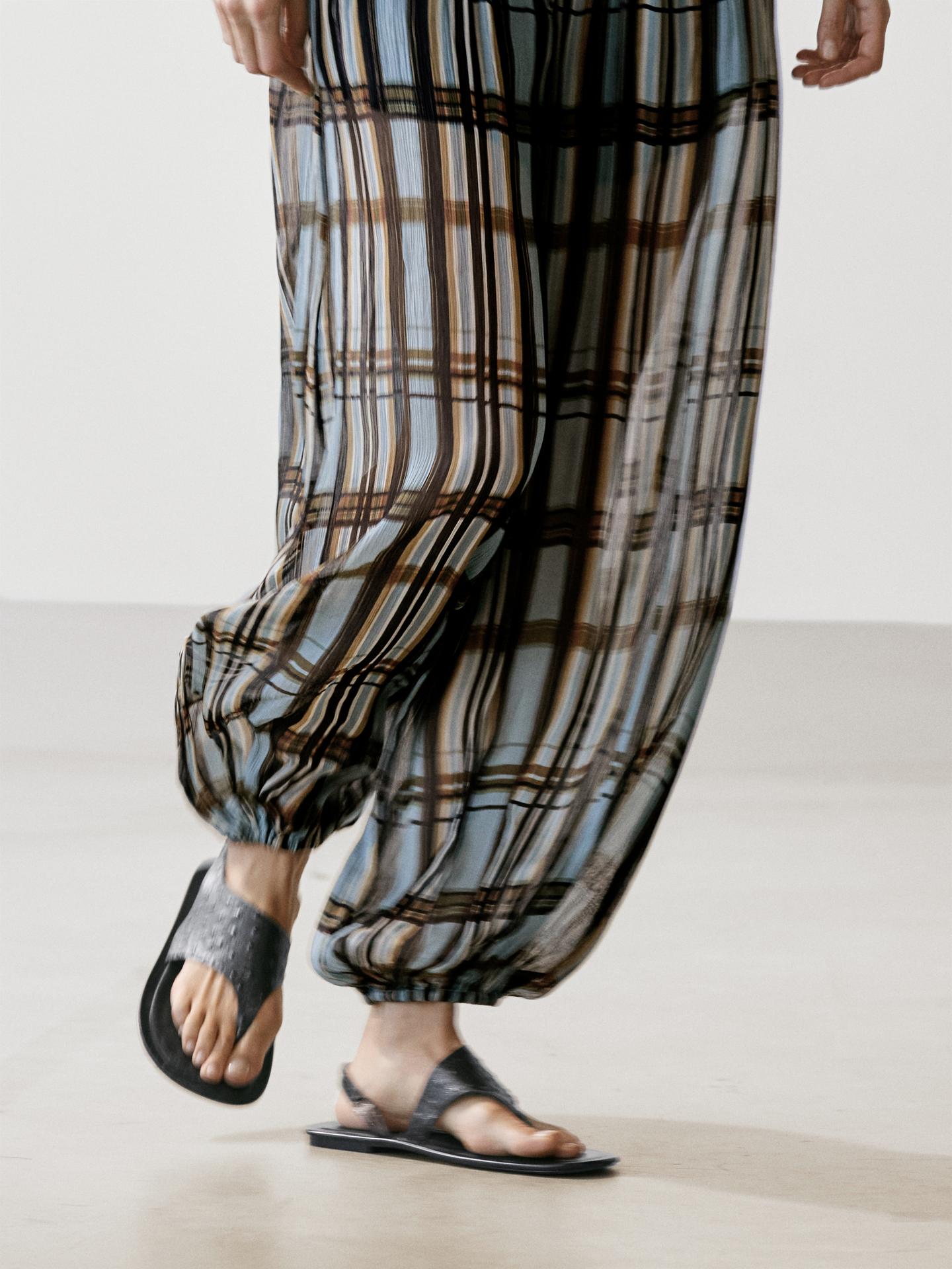 The Plaid Plissé Harem Pants, Designed with a relaxed, wide-leg