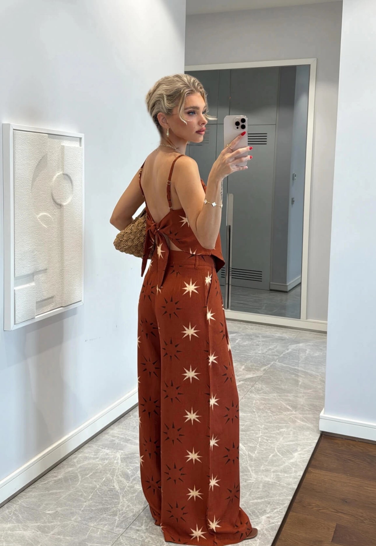 A matching set consisting of a handkerchief-hem camisole and coordinating wide-leg palazzo pants.