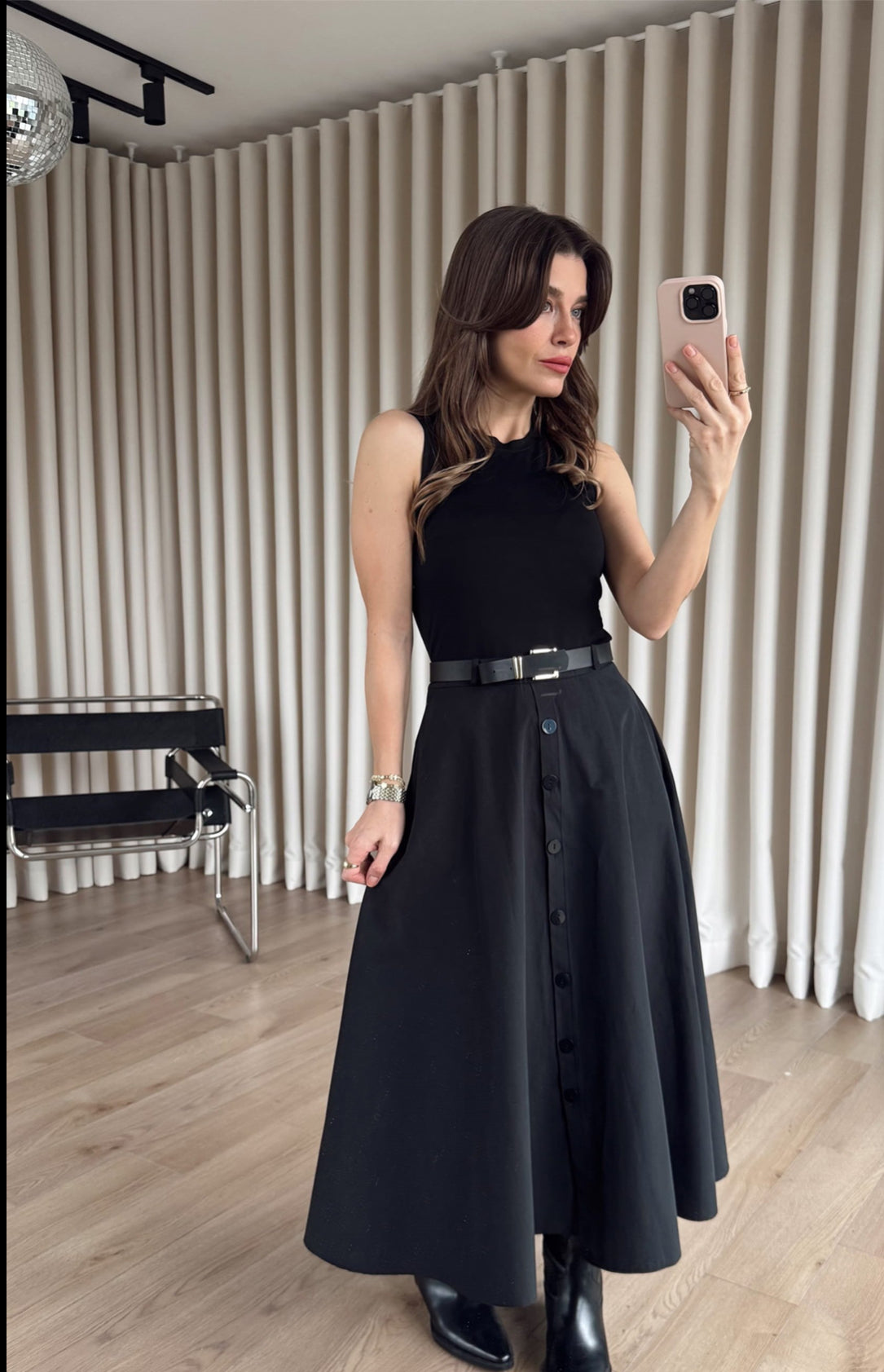 Black Dress From the button-down front to the cinched belted waist, this is “one and done” dressing at its finest.