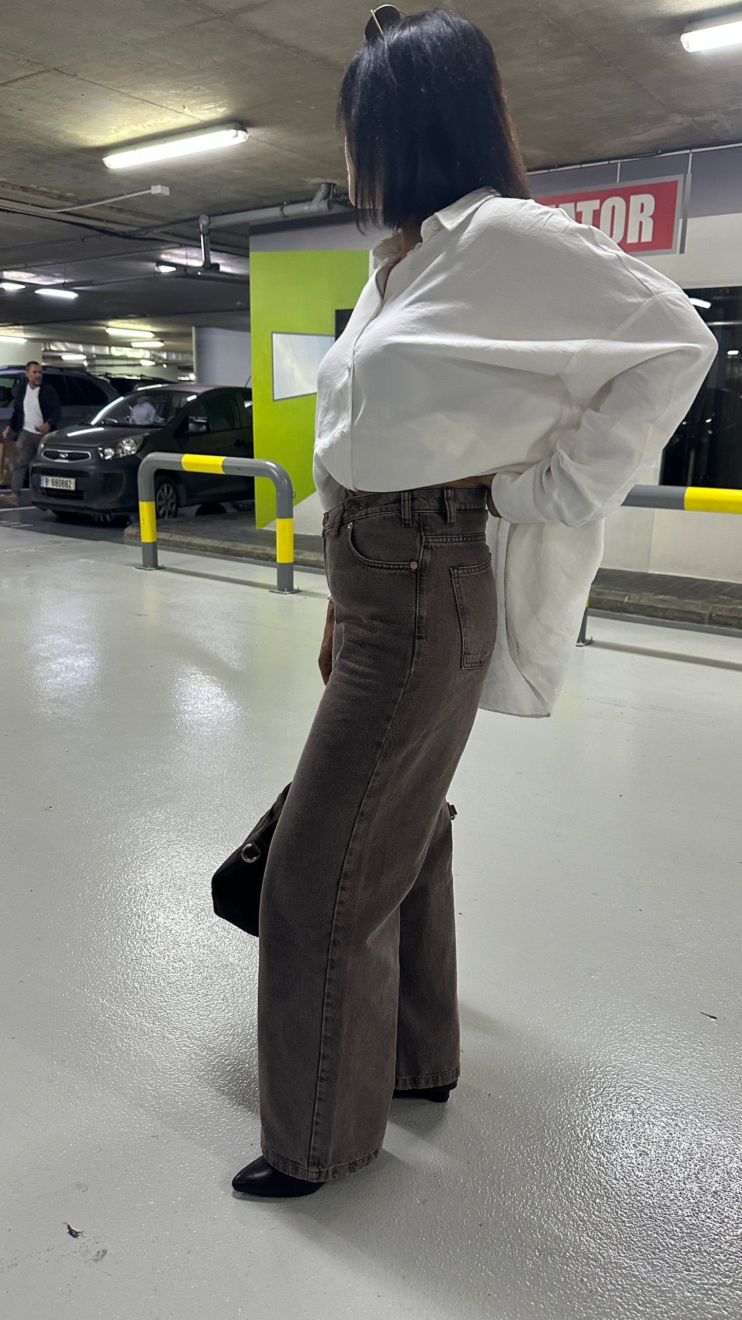 The Cross-Over Statement Jeans. Asymmetric, cross-over waist, flattering fit, premium washed brown denim, wide-leg.