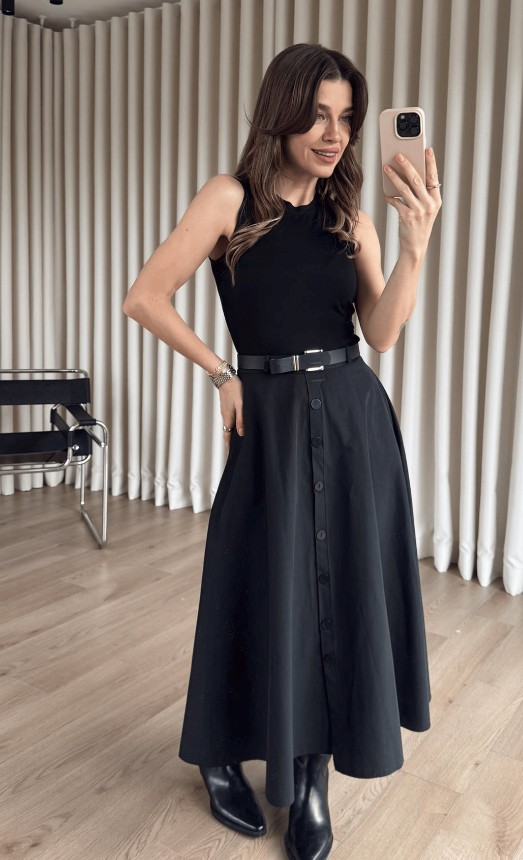Black Dress From the button-down front to the cinched belted waist, this is “one and done” dressing at its finest.