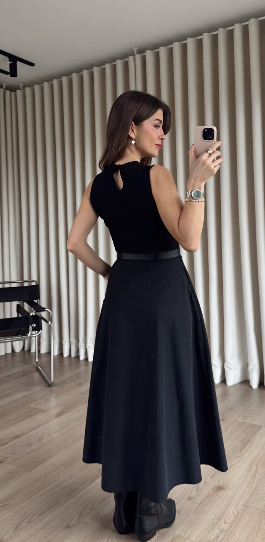 Black Dress From the button-down front to the cinched belted waist, this is “one and done” dressing at its finest.