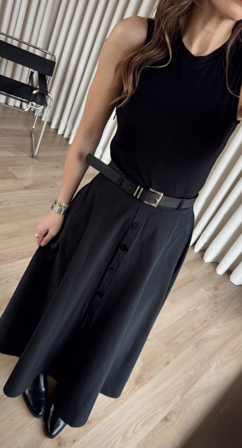 Black Dress From the button-down front to the cinched belted waist, this is “one and done” dressing at its finest.
